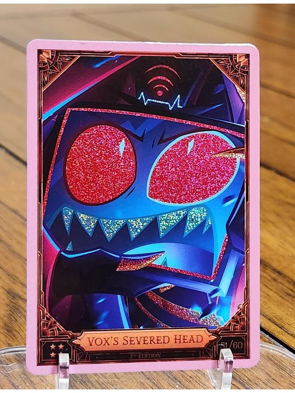 Vox's Severed Head foil trading card - Hazbin Hotel